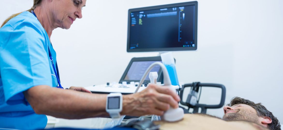 Man getting ultrasound of a abdomen from doctor