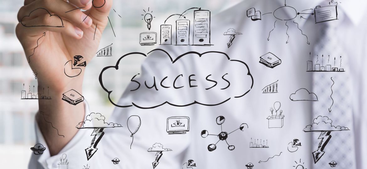 businessman-drawing-keys-success